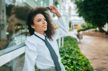 Portrait of relaxed woman touching her hair.