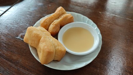 Deep fried Chinese dough stick with sweetened condensed milk.