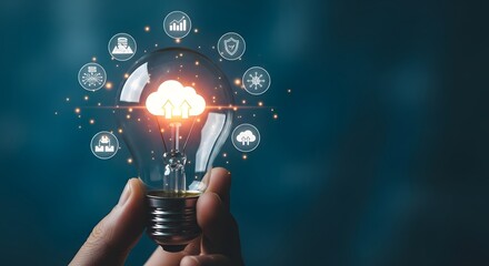 Hand holding light bulb with cloud computing and data icons surrounding it representing innovative cloud technology solutions