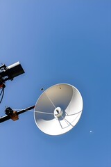 Satellite Dish on Pole with Blue Sky