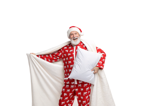 Man in red sheep-patterned pajamas hugging white pillow with blanket wearing Santa hat happily, isolated on a transparent background