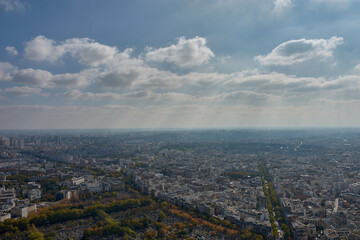 City of Paris seen from Montparnasse with a dense urban layout and classical architecture on a partly cloudy day