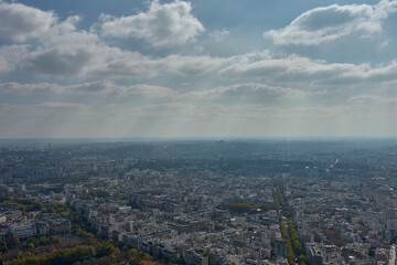 City of Paris seen from Montparnasse with a dense urban layout and classical architecture on a partly cloudy day