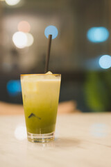 refreshment activity in summer from ice green tea latte in modern and cozy coffee shop background