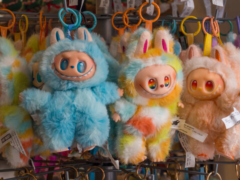 Labubu designer plush toys and keychains on rack in gift shop &mdash; editorial 18 October 2025, Innsbruck, Austria.