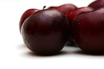 Fresh ripe red plums close-up for healthy eating
