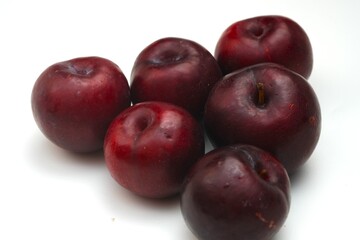 Fresh ripe red plums close-up for healthy eating
