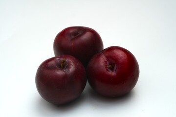 Fresh ripe red plums close-up for healthy eating
