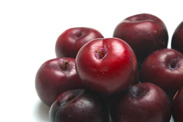 Fresh ripe red plums close-up for healthy eating
