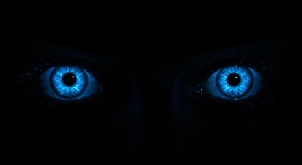 Intense Blue Eyes Glowing in the Dark
