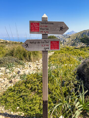 Hiking trail sign for the GR 221 Ruta de pedra en sec route in the Serra de tramuntan mountains in Mallorca