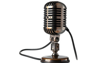 Chrome microphone with black cable on dark background