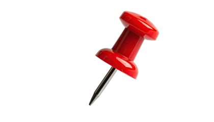 Red pushpin, angled right, on plain black background close-up