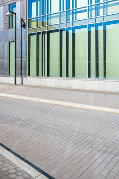 Minimalist urban architecture with empty street and modern infrastructure forming a balanced city perspective and urbanscape design under soft daylight atmosphere showing visual symmetry