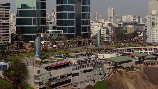 Modern cityscape showing the Larcomar shopping center, Alfredo Salazar Park, and high rise buildings in Miraflores district of Lima