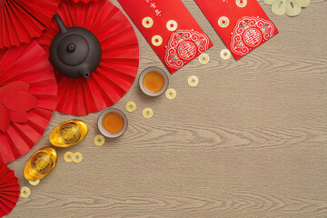 Elegant Chinese New Year setting with tea and gold ingots
