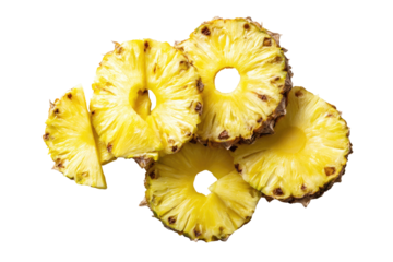 Sliced golden pineapple rings arranged on black background