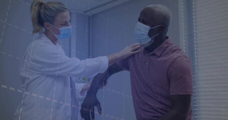 Female doctor assessing male patient shoulder range in exam chair, with lab coat and surgical masks