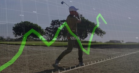 Swinging senior golfer wearing cap and polo in sand bunker, with grid and line chart overlay