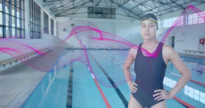Adjusting goggles swimmer wearing racing suit on pool deck, with digital wave graphic, copy space