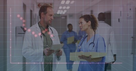 Discussing medical staff exchanging patient data in hospital corridor, with tablet and file folders