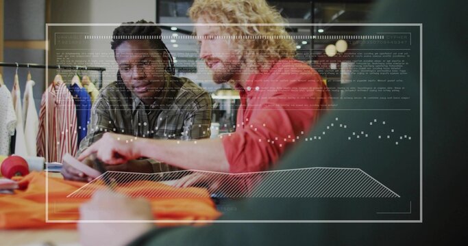 Reviewing designers analyzing garments in studio with tablet, orange fabric and digital overlays