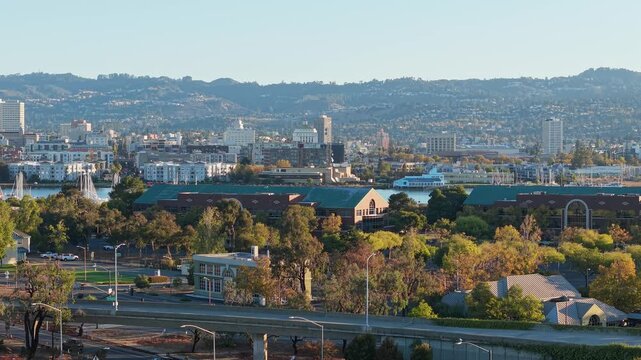 A static view of Webster Street in Alameda California. Downtown Oakland is seen in the distance.