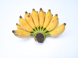 Ripe bananas in a fan like bunch, yellow with brown specks, still attached to a fresh green stem. Displayed on white for a clean, vibrant tropical look.