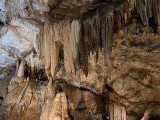 Limestone stalactites and stalagmites in a karst cave