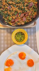 Stir-fried pork with basil, Chinese sausage and fried egg. Menu photo.