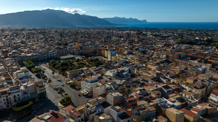 Aerial view of the city of Alcamo, located in the province of Trapani, Sicily, Italy. In the background is the Gulf of Castellammare and the Mediterranean Sea.
