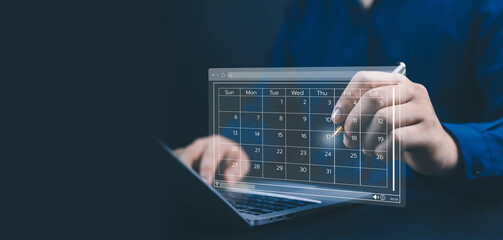 Businessman using laptop with digital calendar interface, symbolizing time management, schedule planning, productivity, organization, and business efficiency through modern technology and project