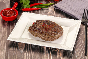 Grilled beef burger cutlet with sauce