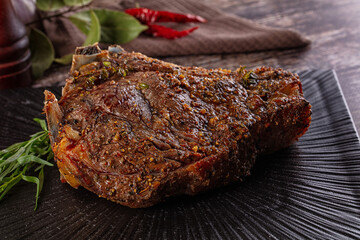Baked beef steak on the bone