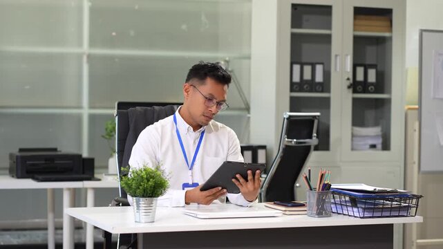 Depressed businessman packing up office after job loss. business failure, unemployment, and workplace stress in times of economic downturn.