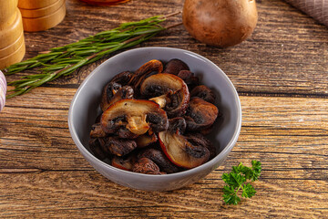 Fried champignon slices in the plate
