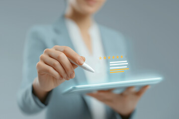 A person uses a stylus on a tablet, displaying interactive elements like stars and bars, suggesting digital feedback or review processes.