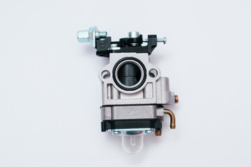 Fototapeta premium New carburetor for small engine. Replacement part for trimmer or chainsaw.