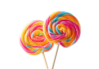 Two colorful swirled lollipops on sticks against a black background
