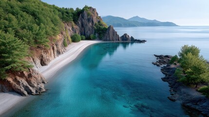 Expansive Panoramic View of a Pristine Rocky Beach Meeting the Shimmering Turquoise Ocean Under a Clear Blue Sky with Lush Green Trees and Jagged Cliffs in the Background