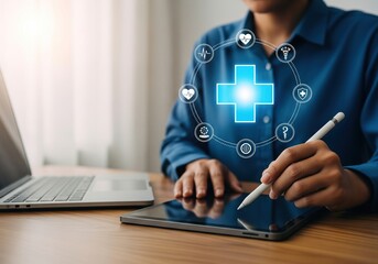 Person using digital tablet with glowing medical icons and laptop