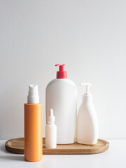 Cosmetic Bottles on Wooden Tray
