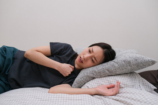 Woman coughing with chest pain