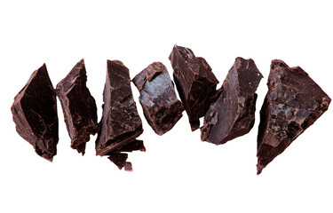 Dark chocolate chunks scattered against a black background