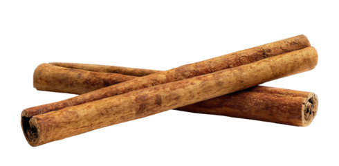 Two rolled cinnamon sticks crossed on a black background