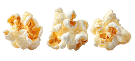 Three fluffy popped corn kernels on a black background