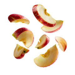 Sliced red apple pieces floating in air