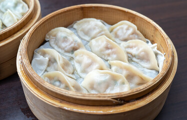 Steamed dumplings in bamboo steamer.