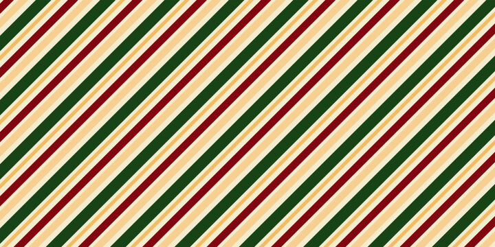 A diagonal stripe pattern in traditional Christmas colors. A festive seamless background for the holiday season, gift wrapping, and winter holiday concepts.