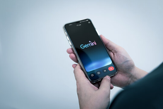 Bangkok, Thailand 1 November 2025. Man use Gemini AI app on smartphone. artificial intelligence (AI) developed by Google, ability to process a wide variety of data.